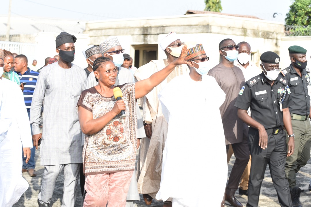 FCT Minister Muhammad Musa Bello (3rd right) with security and community leaders on tour of factories invaded at the Idu Industrial Zone on Tuesday